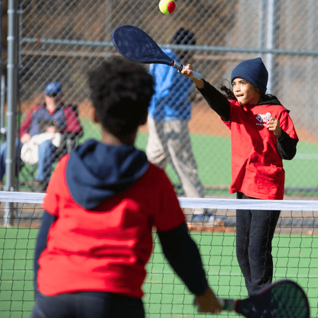 Kid building confidence through SMART Tennis lessons at Tennis Time Academies
