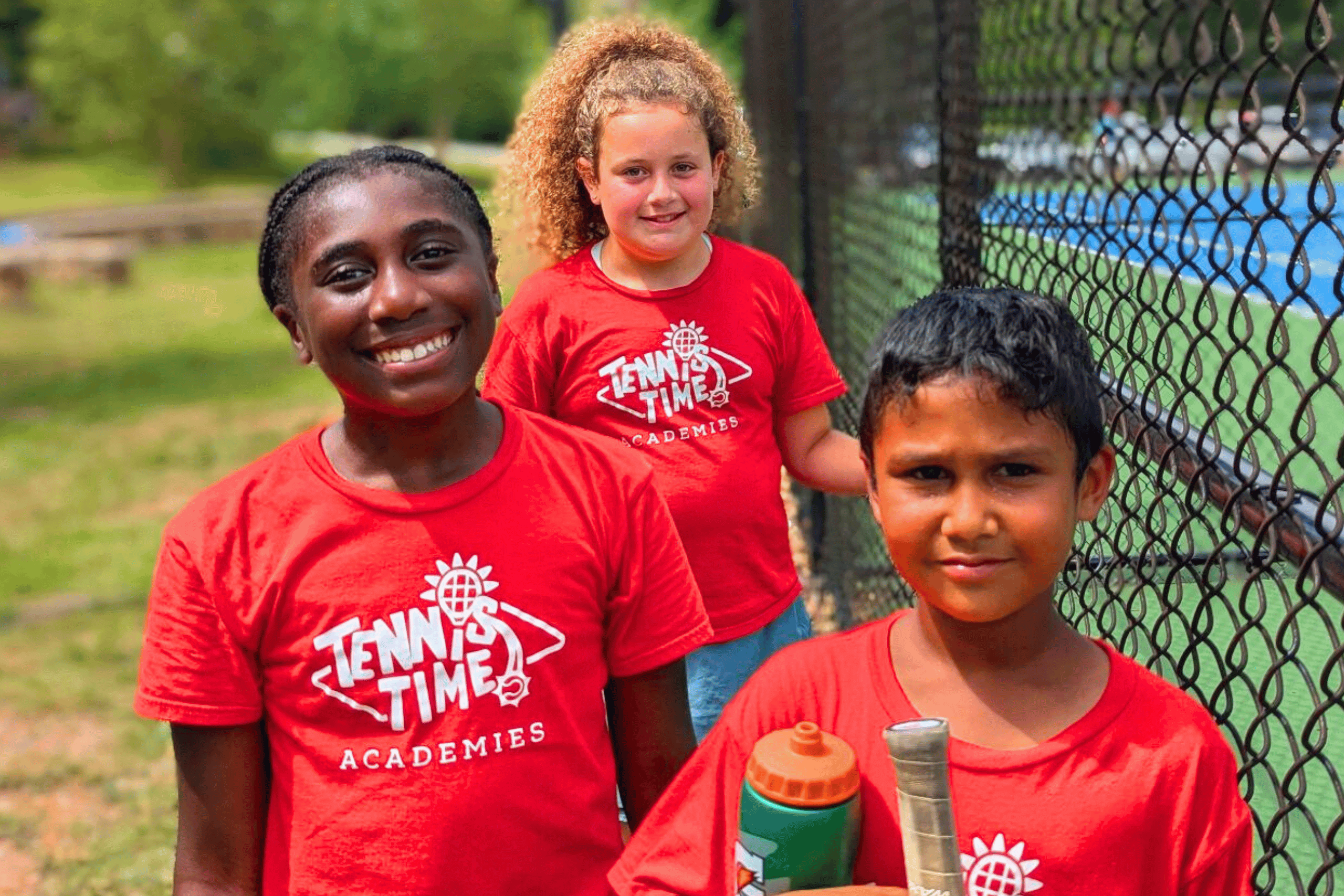 Kids playing junior team tennis at the State Championships