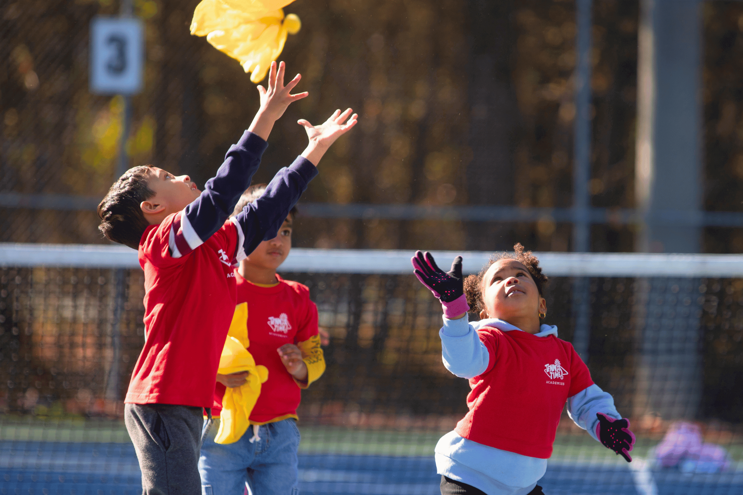 Young children in the Little Bouncers program learning tennis fundamentals with fun, interactive activities at Tennis Time Academies, designed for ages 3 to 4.