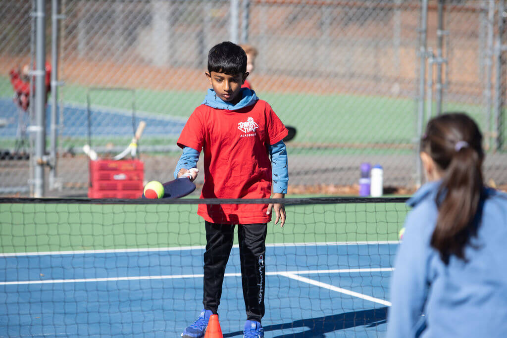 young kid trying his best during the training