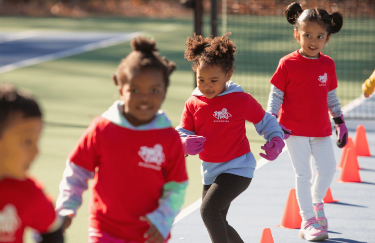 Young children participating in a Tennis Time Academies Little Bouncers class, focusing on fun, agility, and coordination exercises for kids aged 4-5 as part of an engaging tennis program.